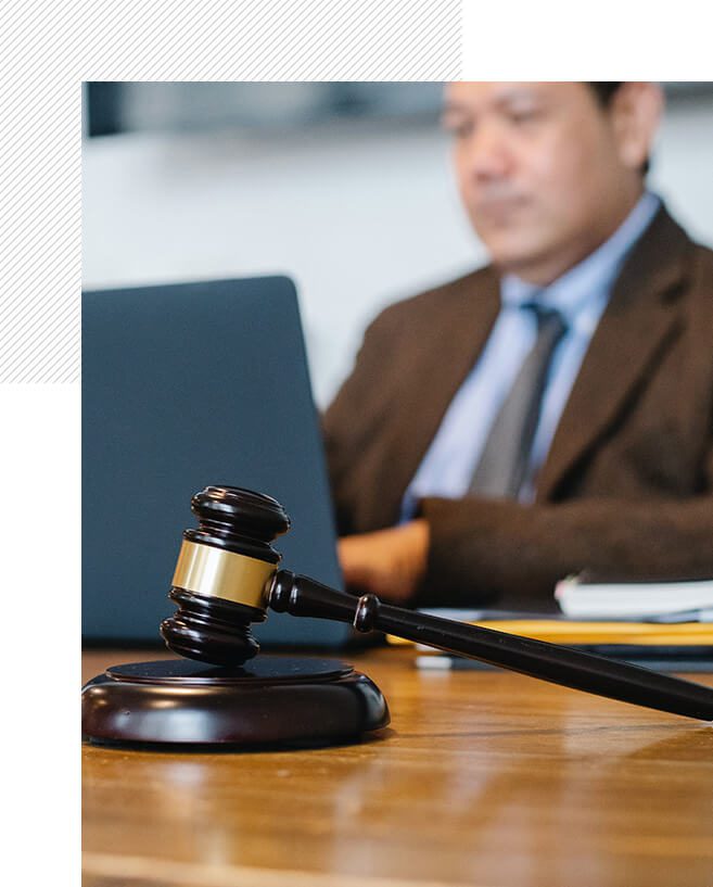 The Perez Law Group A judge 's gavel sitting on top of a wooden table.