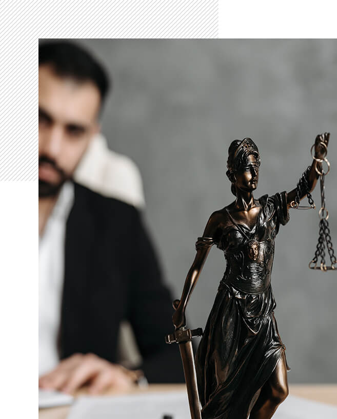 A statue of lady justice and a man in suit.